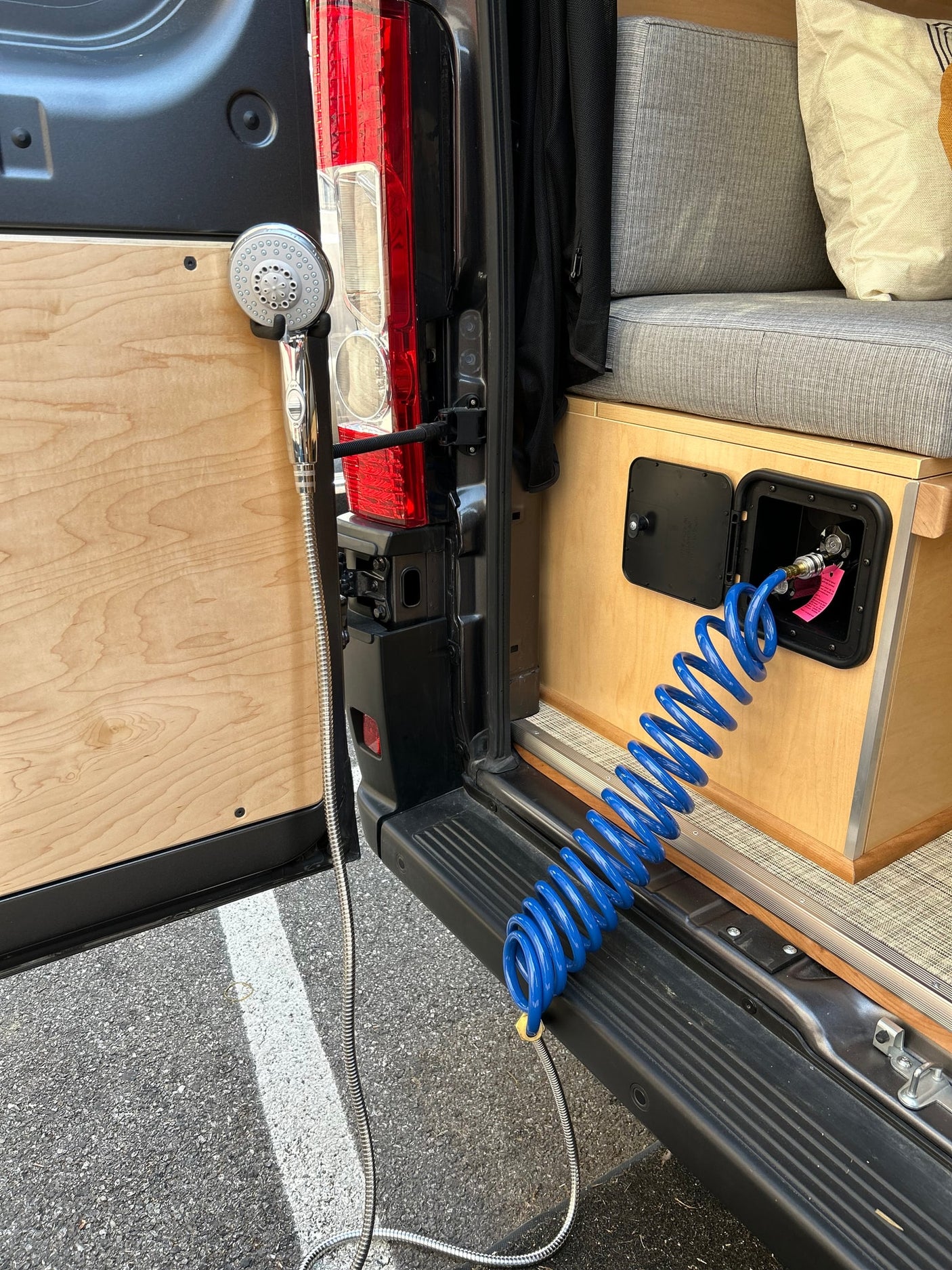RV rental with convenient outdoor shower and water hookup for mobile living.