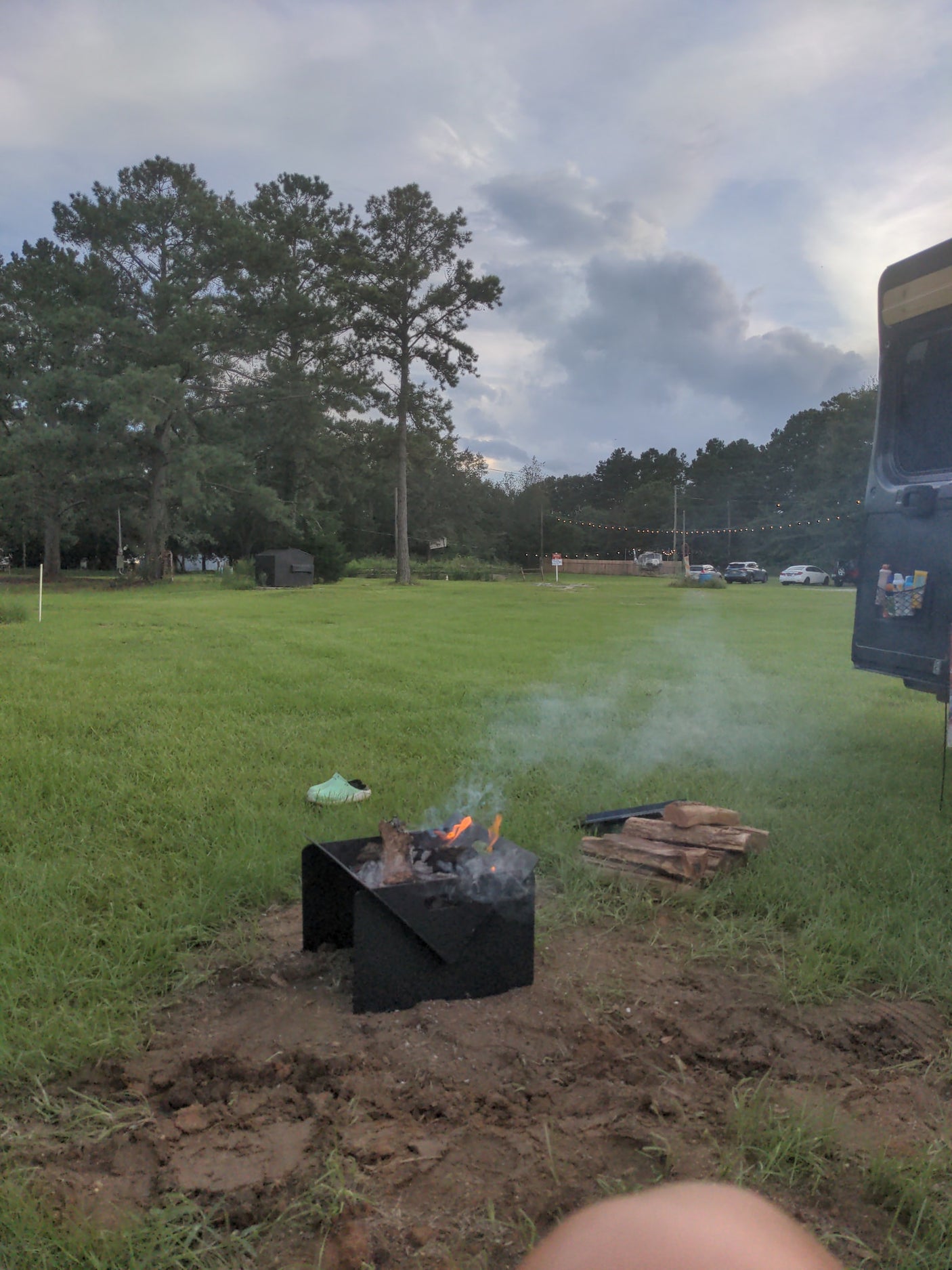 & accessible overhead storage with dishes & a basket.|Adventure awaits! Dark gray RAM ProMaster camper van