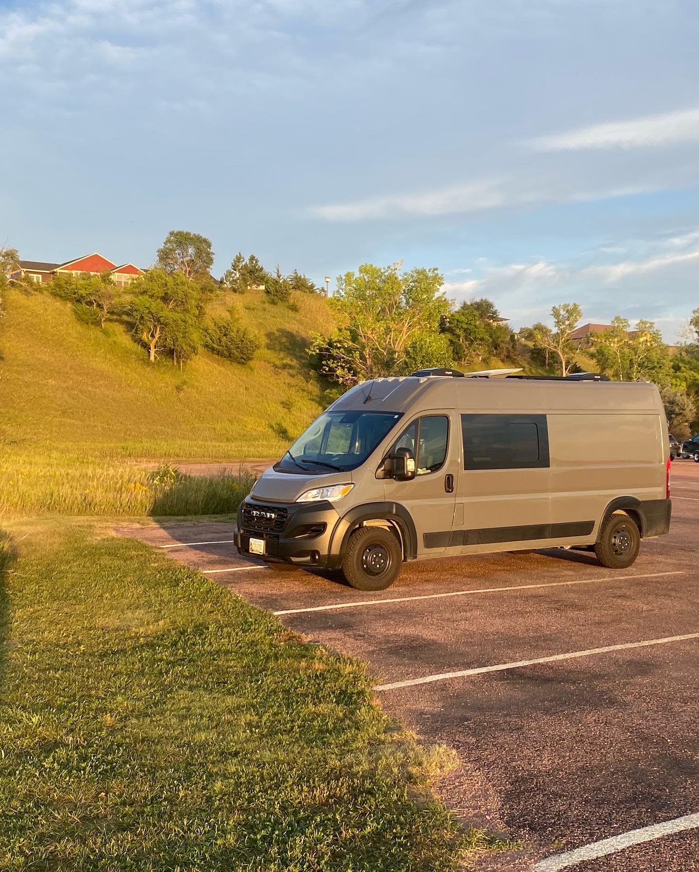 and comfy seating. Perfect for van life adventures!|Spacious & modern camper van interior