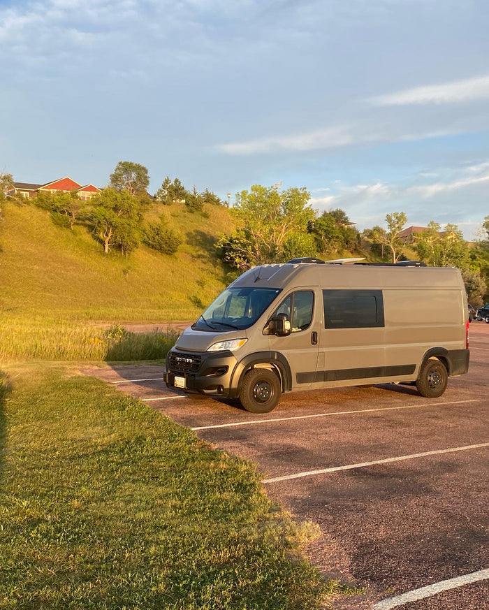 and comfy seating. Perfect for van life adventures!|Spacious & modern camper van interior