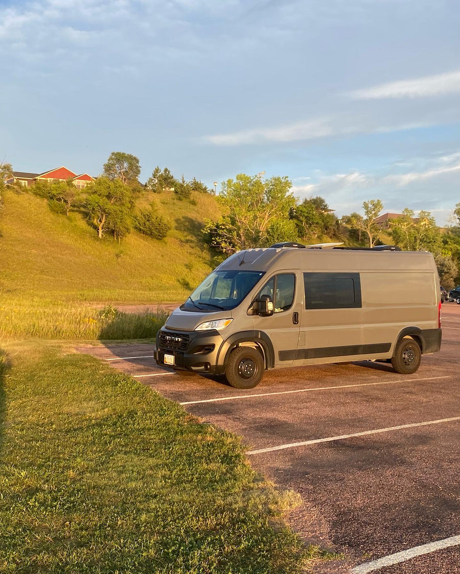 and comfy seating. Perfect for van life adventures!|Spacious & modern camper van interior