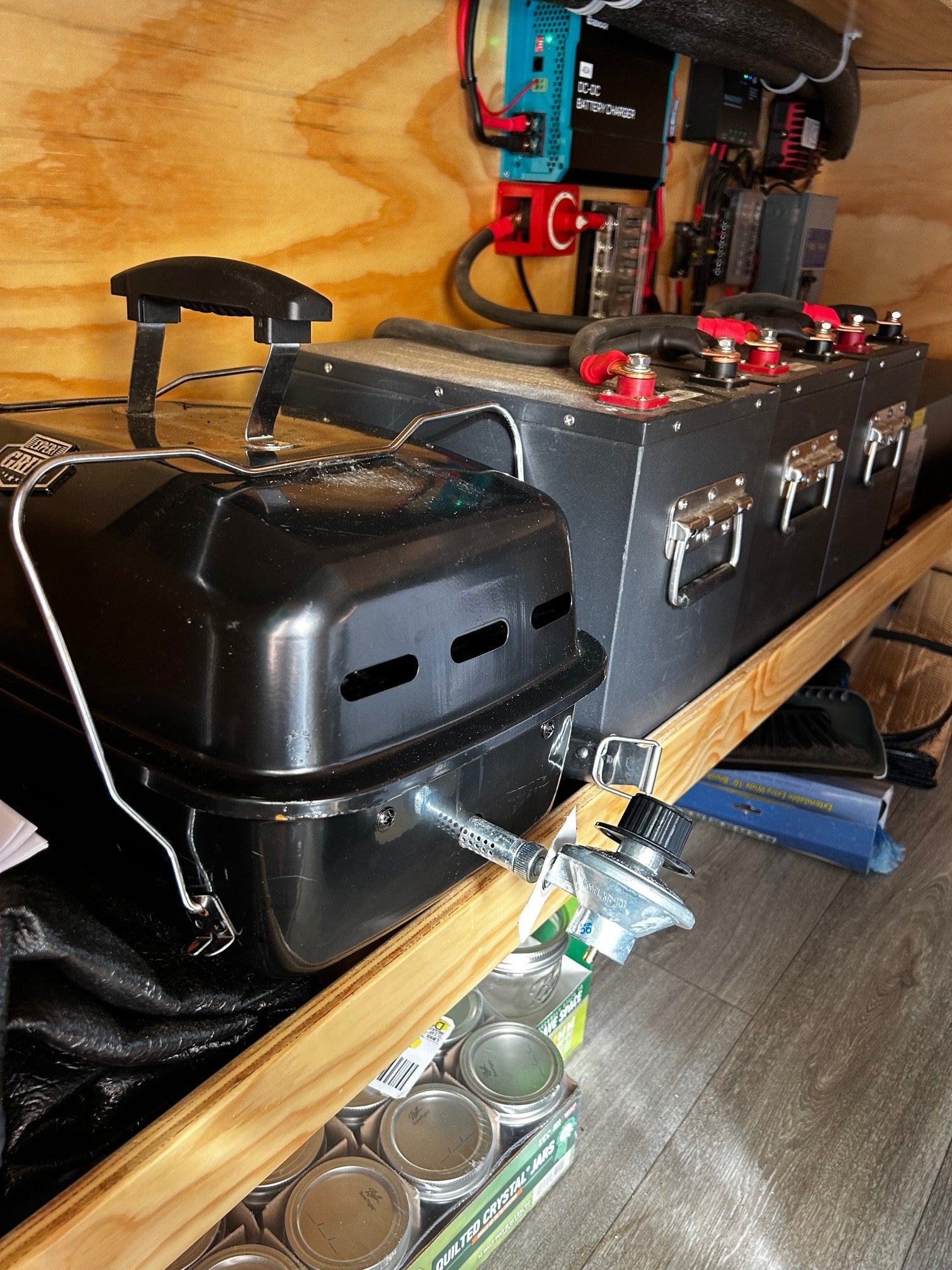 and dining setup for comfortable mobile living.|RV rental's electrical control panel: Renogy battery monitor