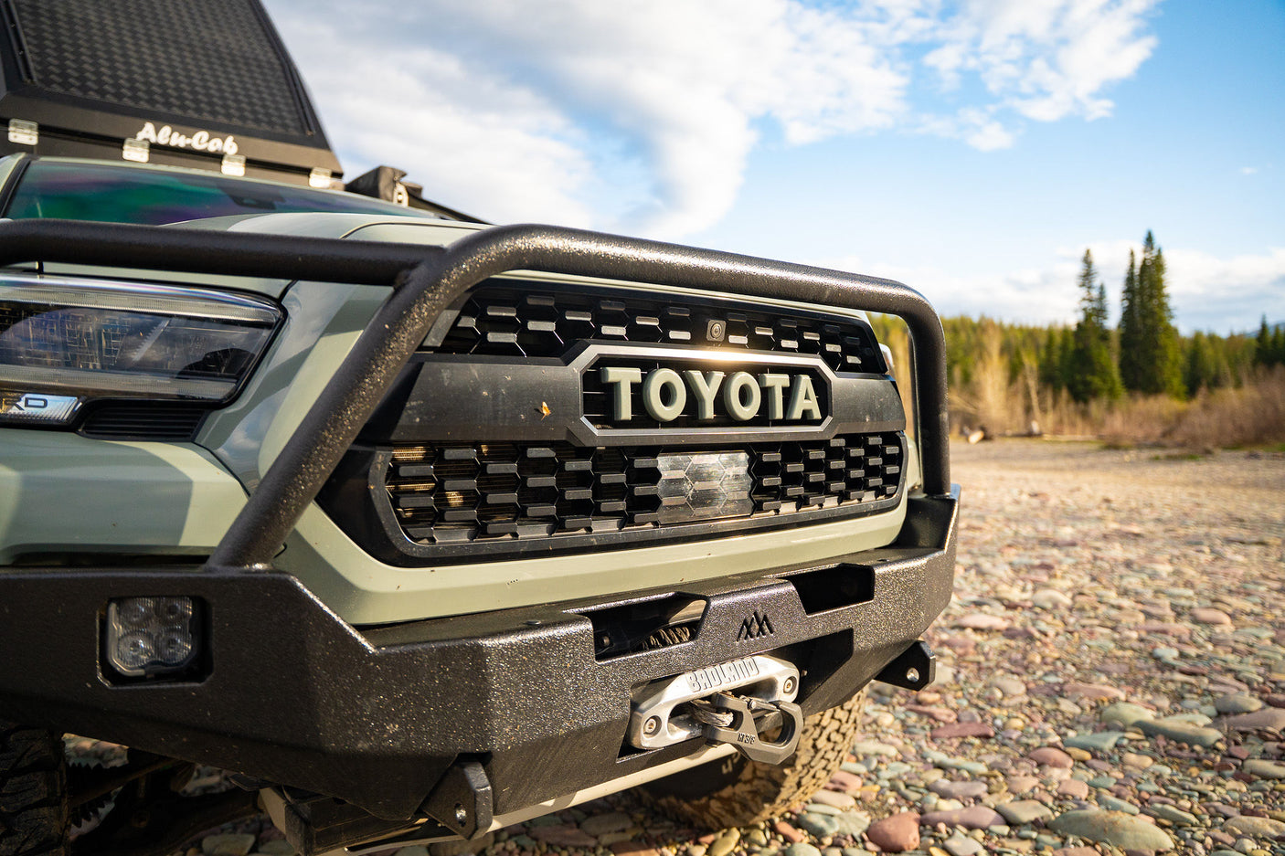 similar to an RV rental.|A gray Alu-Cab rooftop tent
