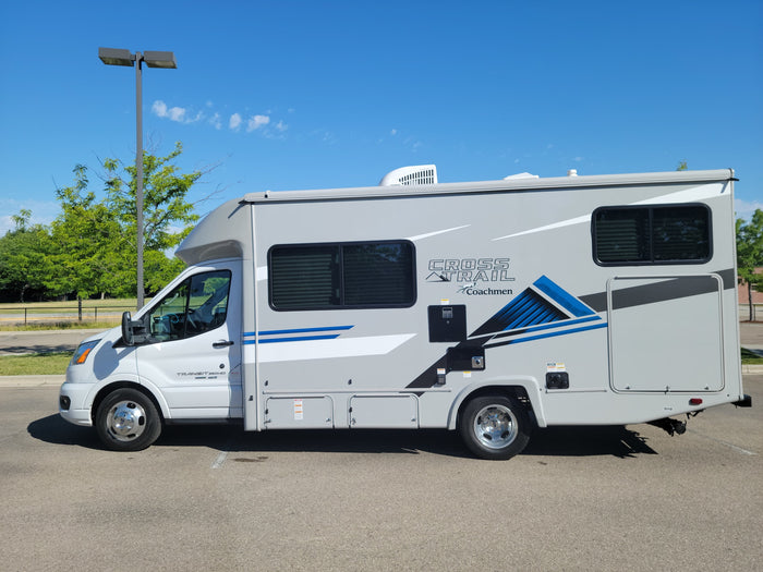 Sleek grey Coachmen Cross Trail Class C RV rental parked outdoors, ready for your next travel adventure.