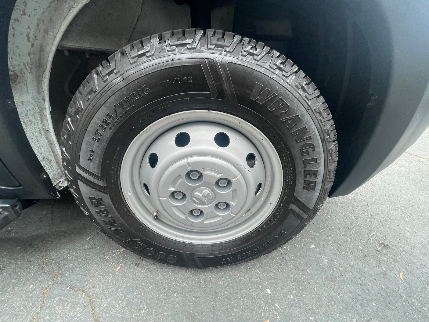 Goodyear Wrangler Workhorse HT LT225/75R16 tire on a Ram steel wheel, common for an RV rental.