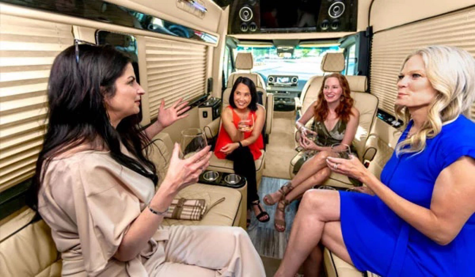 luxurious RV rental interior features cream captain's chairs and ample room