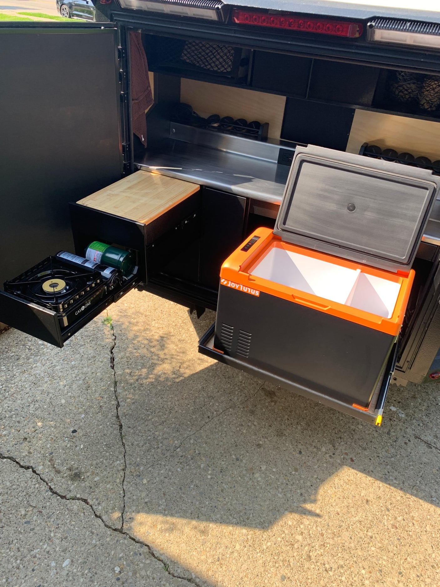 and a window.|Compact outdoor kitchen from an RV rental