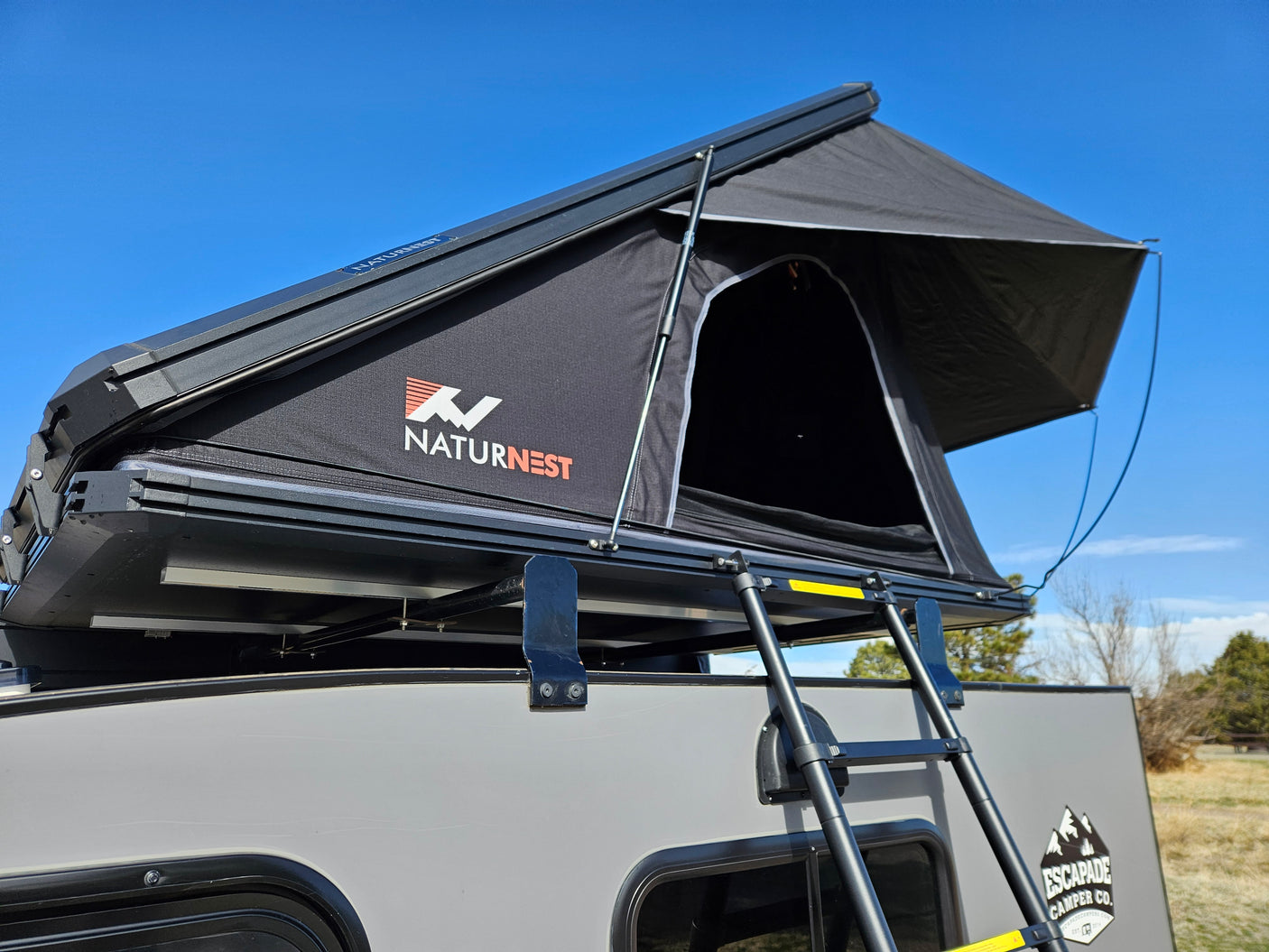 Rooftop tent on an Escapade camper. This NaturNest setup offers a unique RV rental for outdoor adventures.