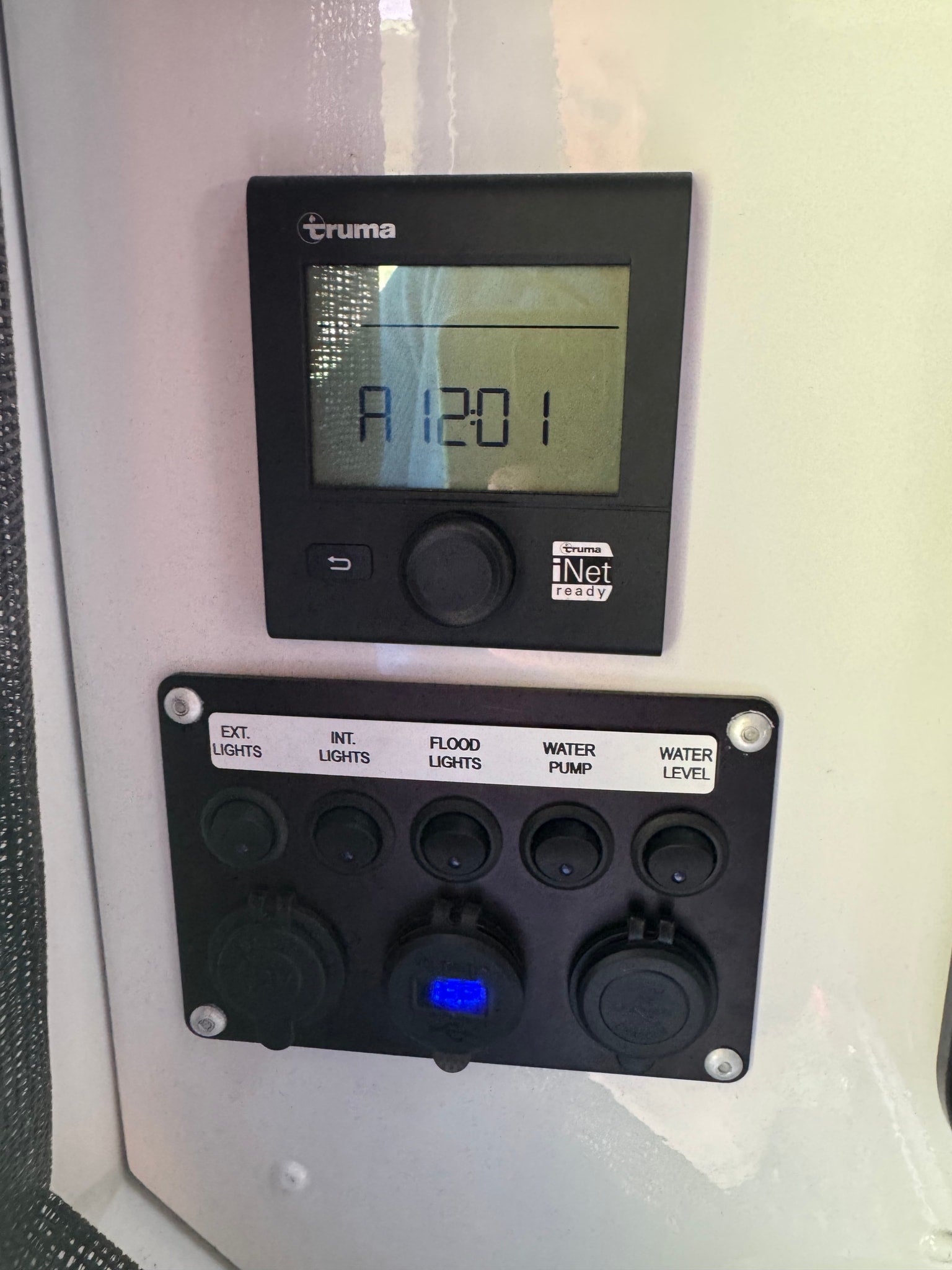 RV rental: Truma heating control with A 1201 display, and switches for lights, water pump, plus 12V power outlets.