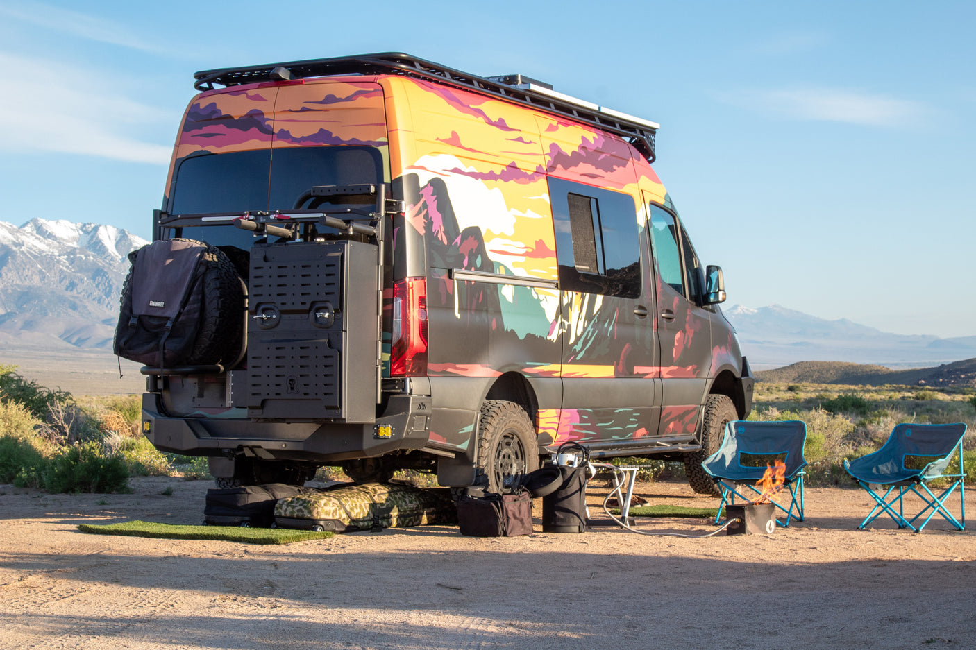 Unlock van life adventure! This custom RV rental camper offers campfires and mountain views.