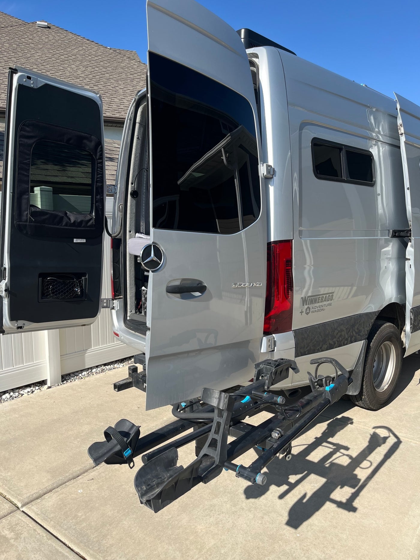Silver Winnebago Sprinter RV rental camper van with open rear doors and a bike rack, ready for adventure. — photo 19