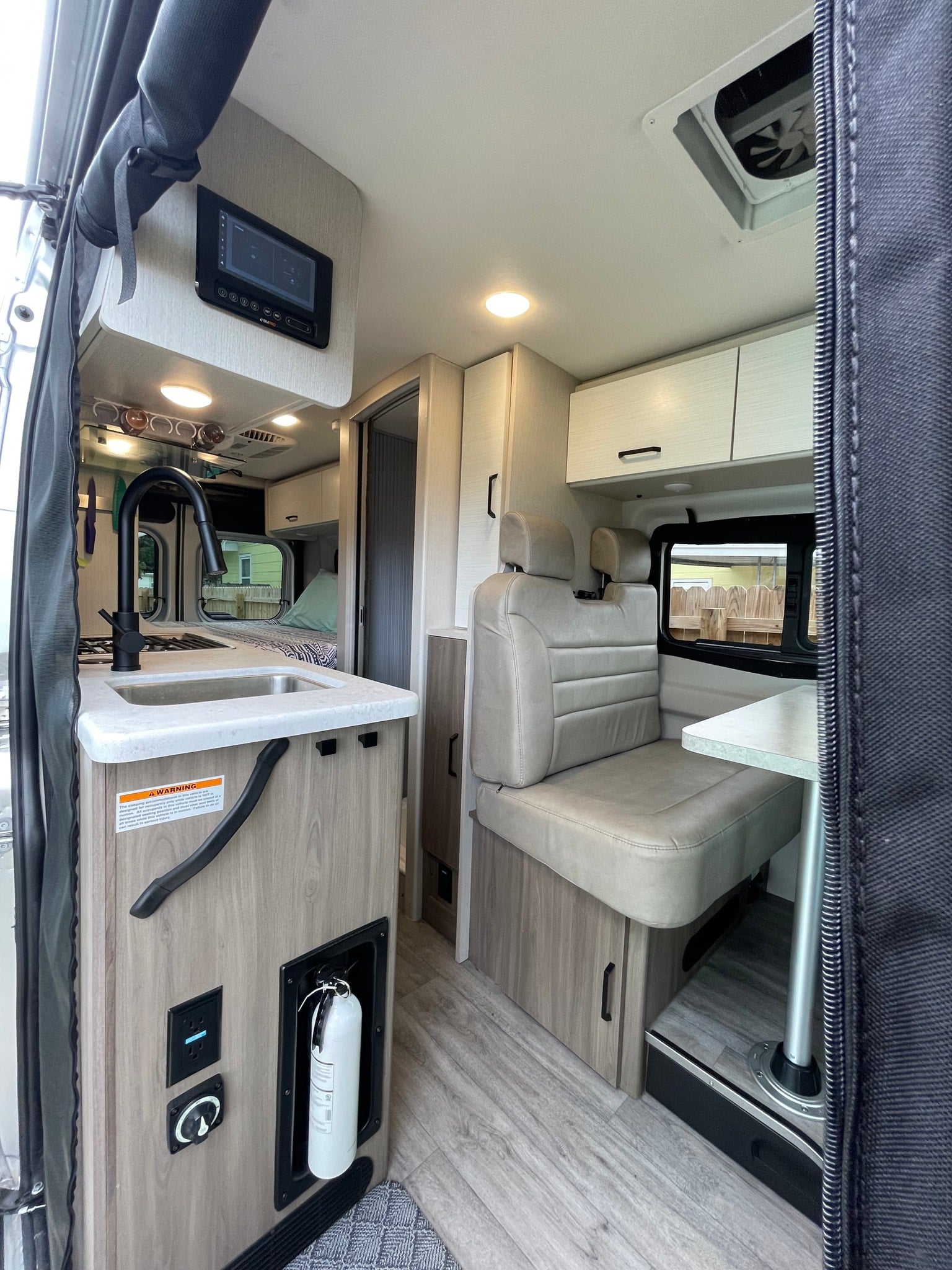 & palm trees. Ideal for adventures!|This rv rental offers a modern interior with kitchen
