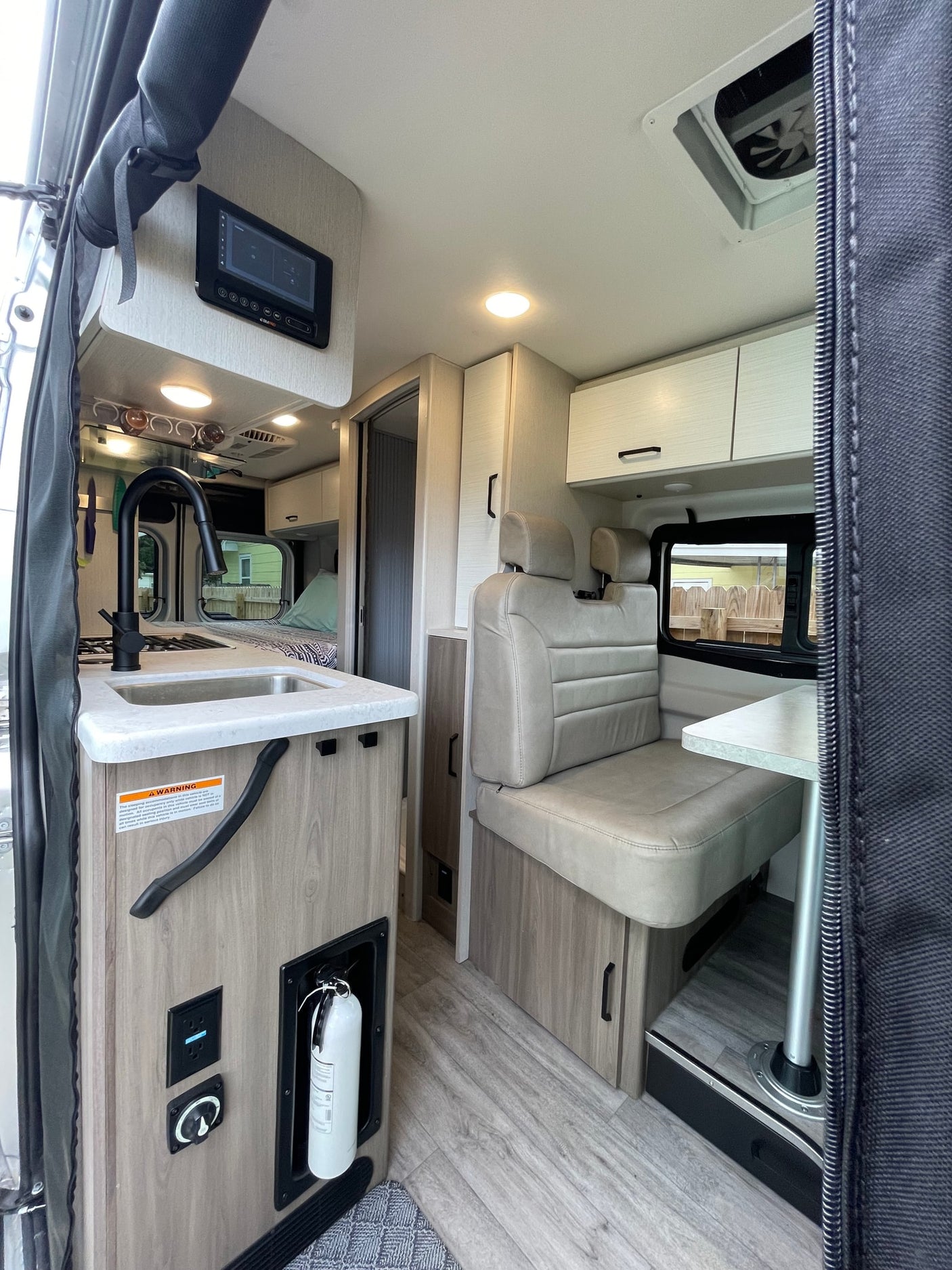 & palm trees. Ideal for adventures!|This rv rental offers a modern interior with kitchen
