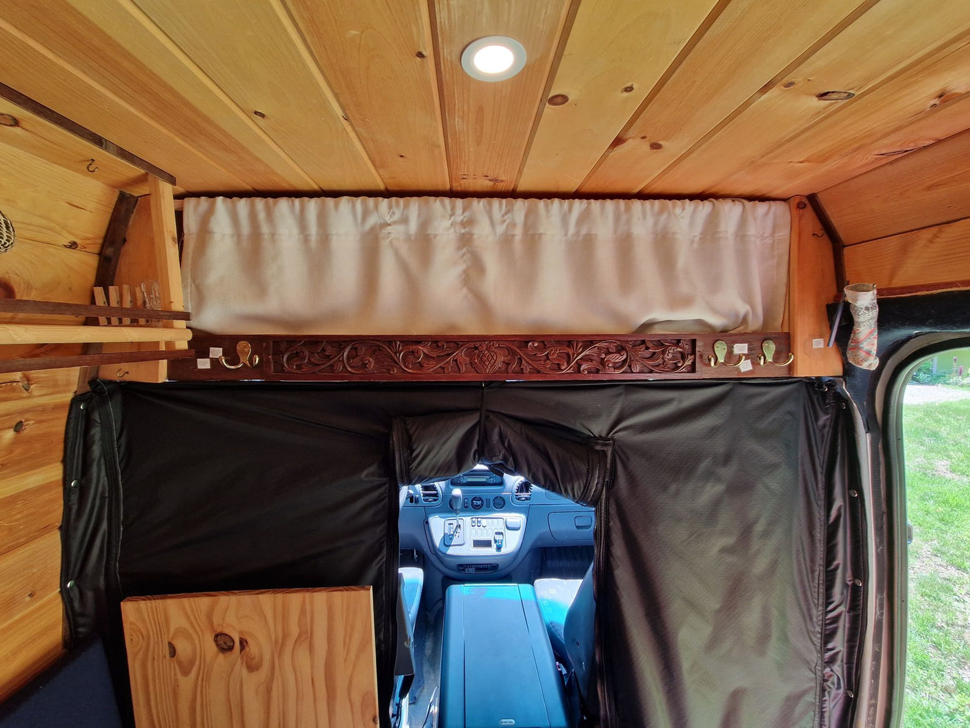 and warm lighting.|This RV rental's warm interior features a wood stove