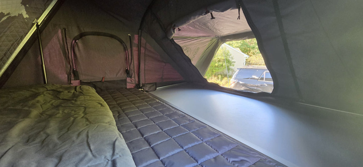 Interior of the Skycamp 3.0 showing the mattress, side window and large screened door panel — photo 5