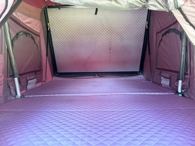 Tent interior showing the full sleeping area, 2 inch foam mattress and dual shoe bags — photo 5
