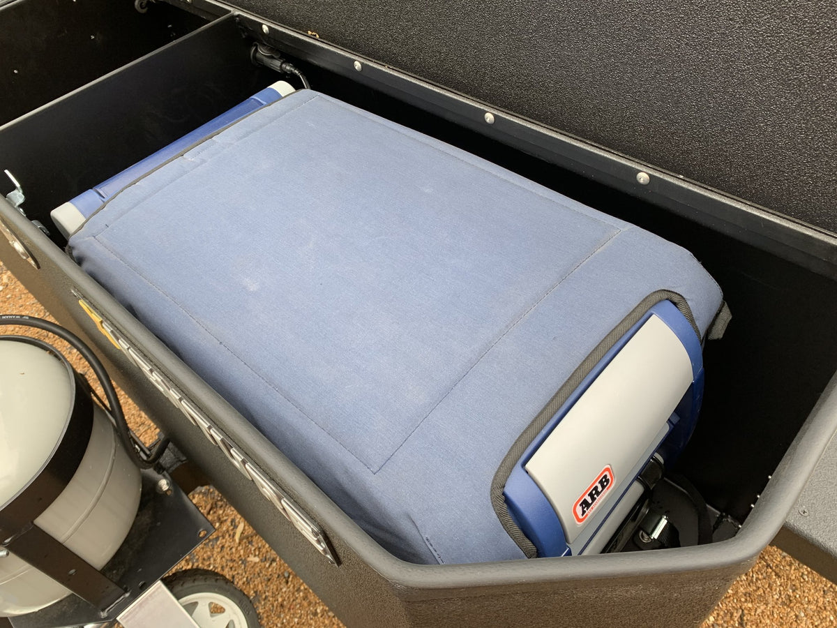 Galley box open with the seat cushion in place and the ARB portable fridge/freezer stowed alongside — photo 20