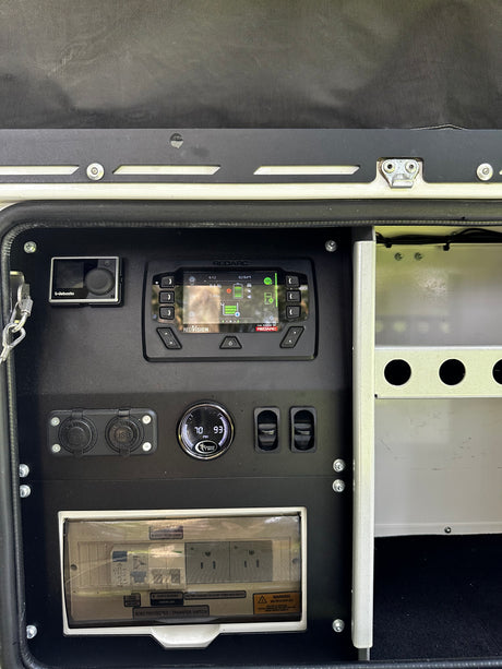 RedVision control panel with tire-pressure gauge and USB charging outlets