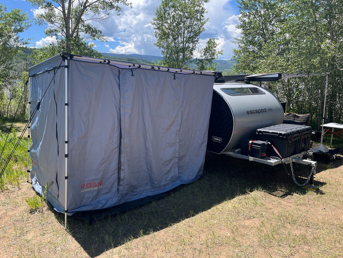 Escapod TOPO at camp with ROAM awning and shower/changing enclosure set up