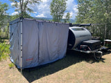 Escapod TOPO at camp with ROAM awning and shower/changing enclosure set up