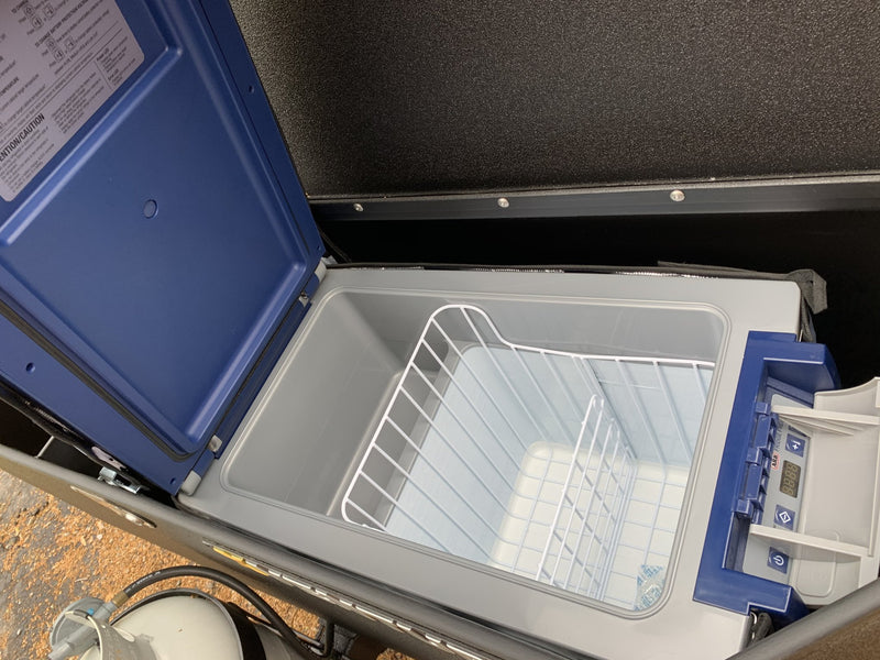 ARB refrigerator/freezer with the lid open, showing the wire basket and digital control panel — photo 21