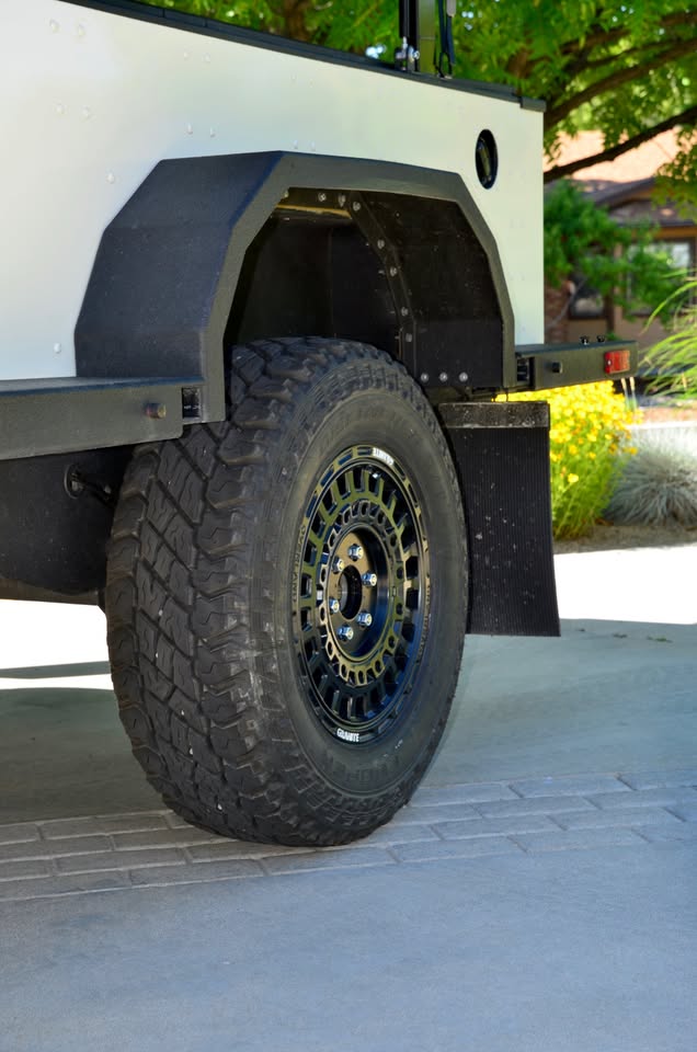 2014 Schutt Industries XVenture XV-2 overland trailer — close-up of the upgraded alloy wheel, Cooper Discoverer S/T Maxx tire and Dexter 3,500-lb torsion axle — photo 15
