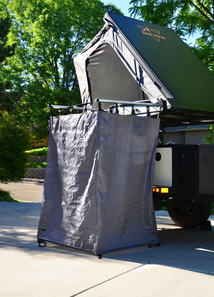2014 Schutt Industries XVenture XV-2 overland trailer — Overland Vehicle Systems shower tent stowed at the rear with rooftop tent open — photo 19