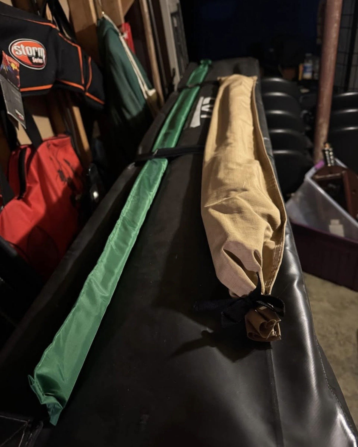 Telescoping ladder and annex pole bags resting on the folded tent — photo 8