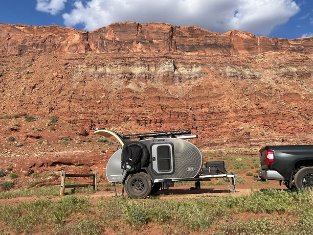 2022 Escapod TOPO teardrop trailer, driver-side profile parked in red-rock desert
