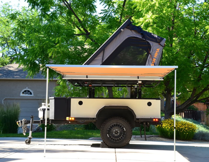 2014 Schutt Industries XVenture XV-2 overland trailer — side view with the ARB awning extended and rooftop tent deployed — photo 2