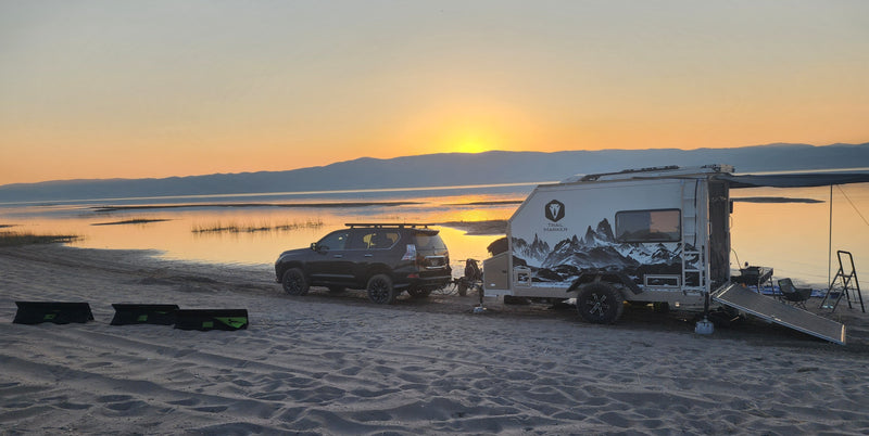Trail Marker overland trailer with awning extended at a lakeside sunset — photo 2