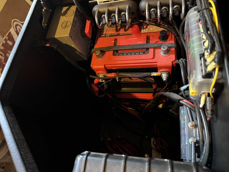 Battery bank with the NOCO Genius on-board charger mounted in the electrical compartment — photo 28