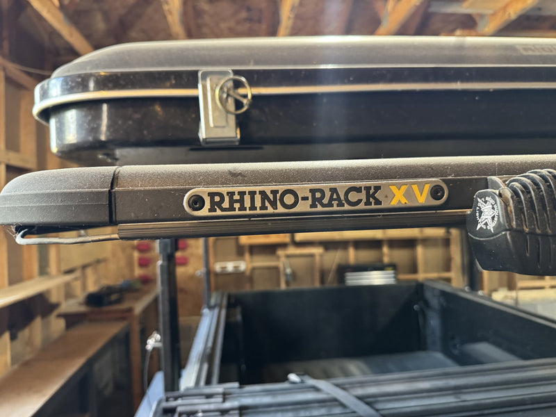 Rhino-Rack XV roof rack crossbars and the Airtop 360 hardshell mounted above the cargo bed — photo 29