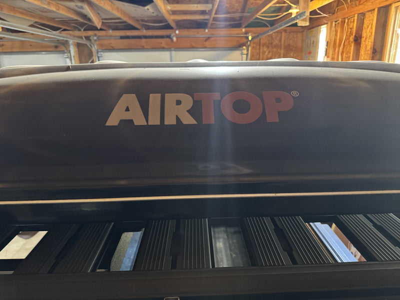 AIRTOP badge on the shell of the Airtop 360 rooftop tent — photo 31