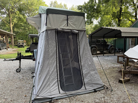 Front view of the rooftop tent with annex room and entry ladder
