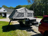 Patriot X3 trailer parked at home, tent up, three-quarter angle