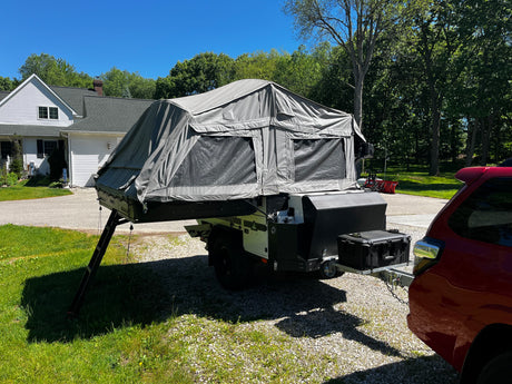 Patriot X3 trailer parked at home, tent up, three-quarter angle