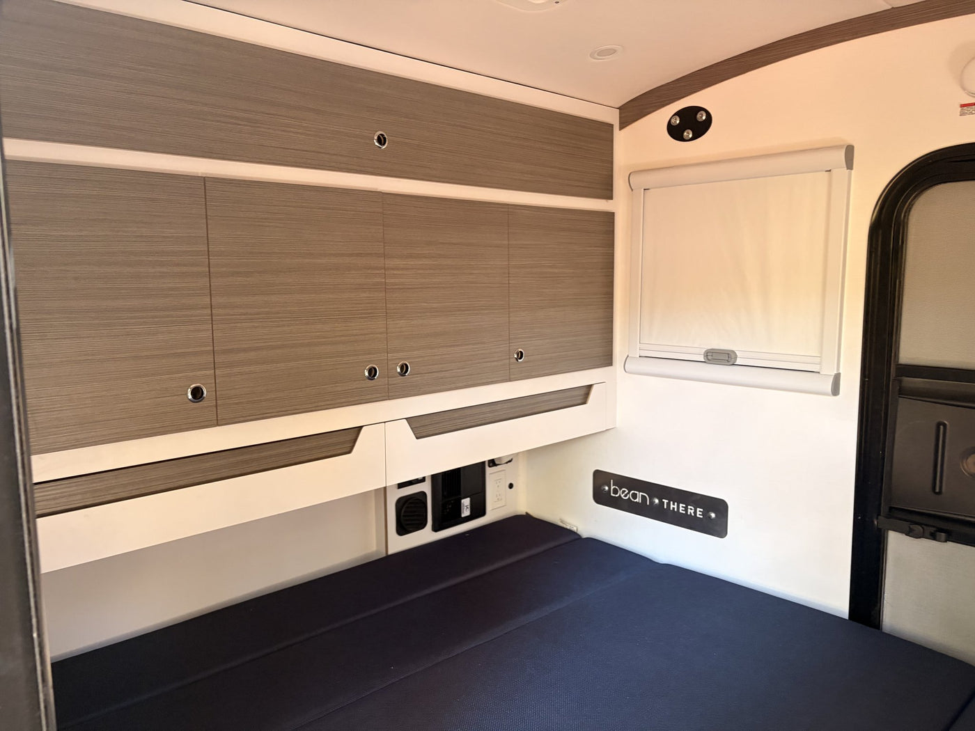 Interior cabin wide view of sleeping area and storage — photo 12