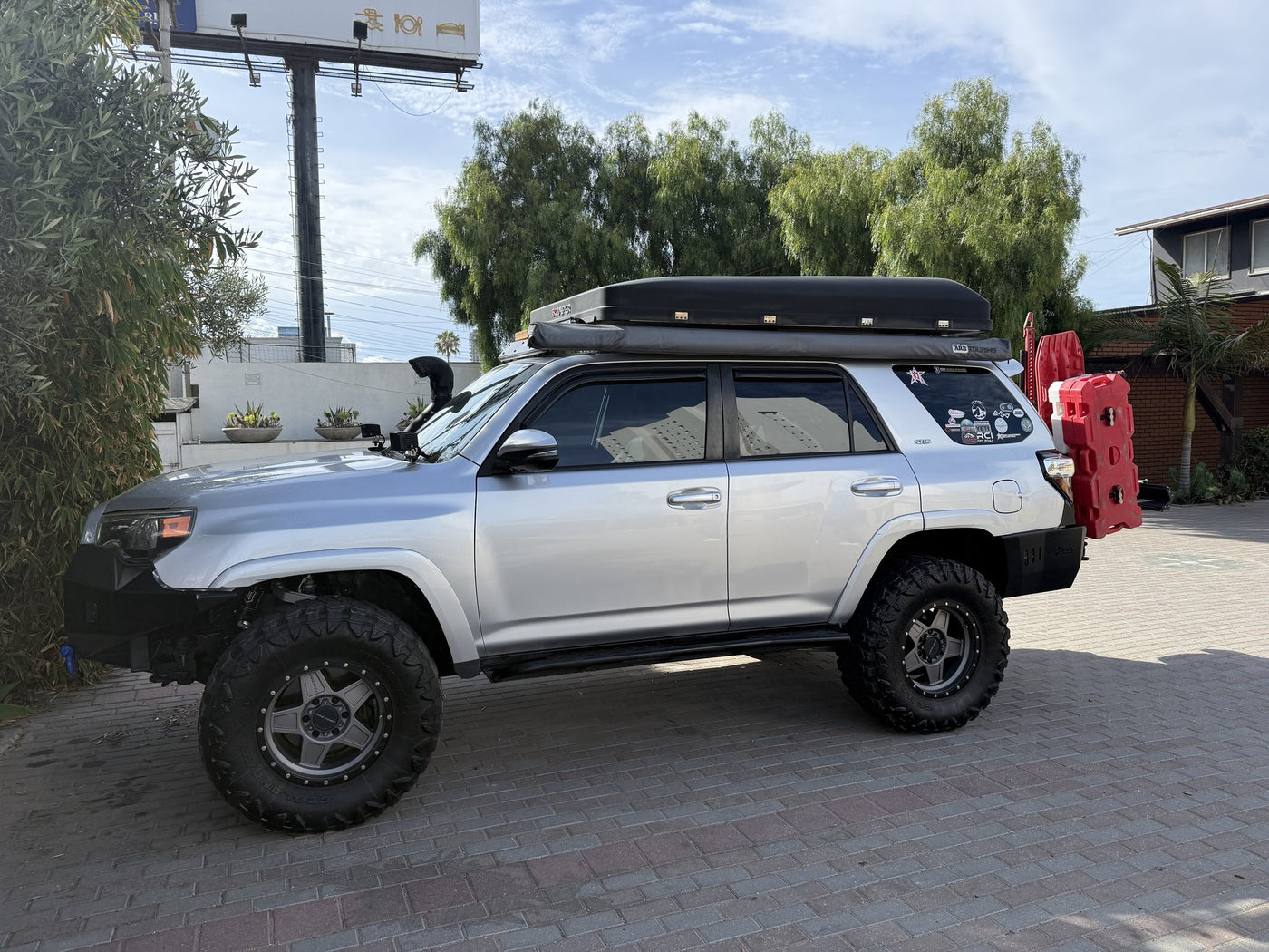 4Runner driver-side profile with Baja roof rack and iKamper rooftop tent — photo 3