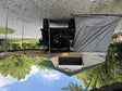 Pope Overland rooftop tent fully set up with annex room and 270-degree awning deployed