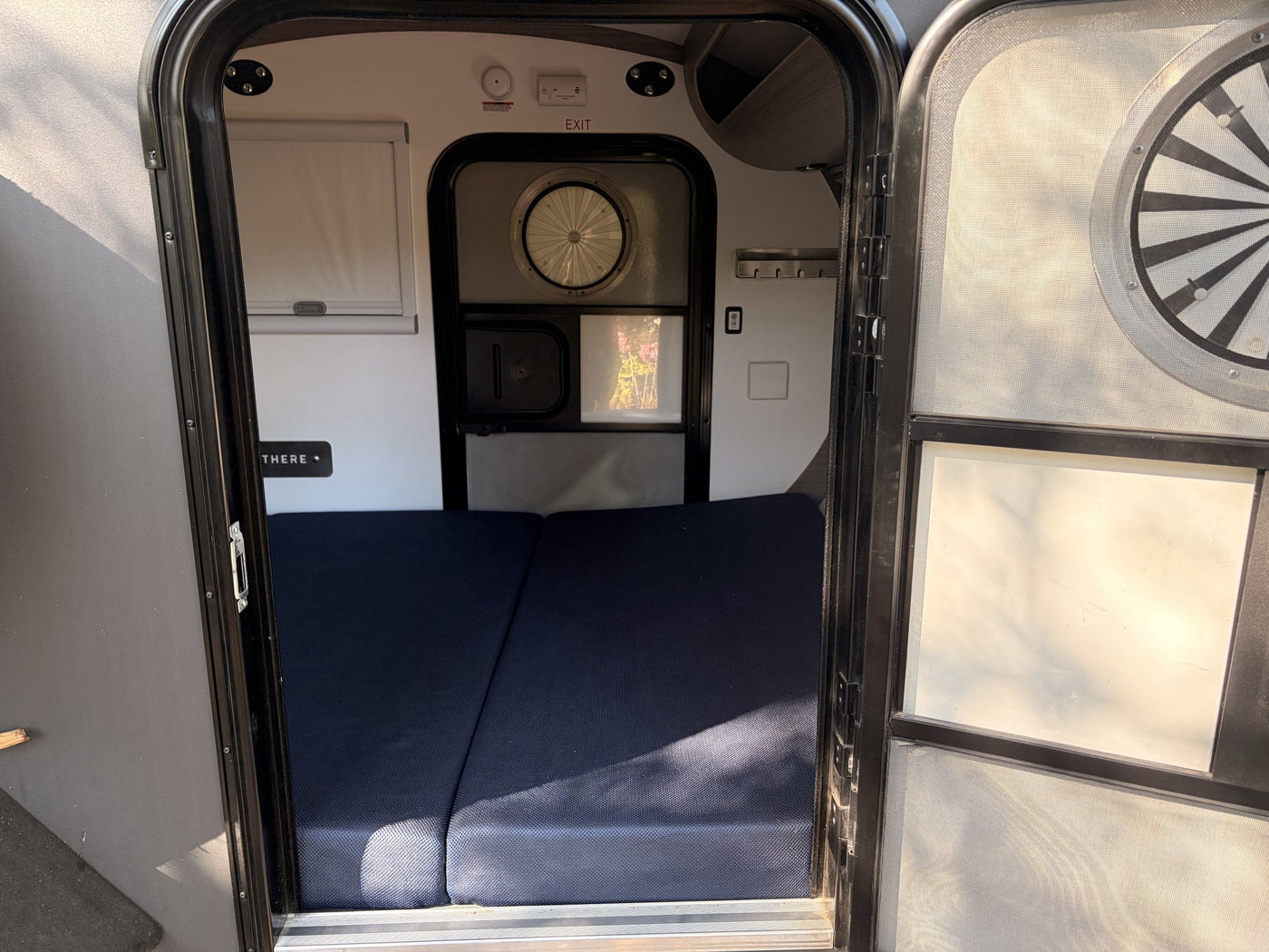Interior cabin with mattress and roof fan vent — photo 10