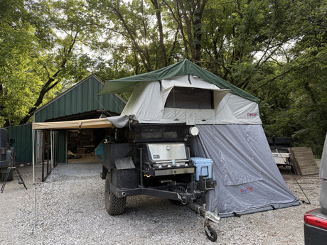 Side view of the Pope rooftop tent, annex room, and awning extended