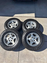 Falken Wildpeak A/T3W 235/75R15 Tires and Stock Jeep Grand Cherokee Wheels in Spanish Fork, UT (photo 1)