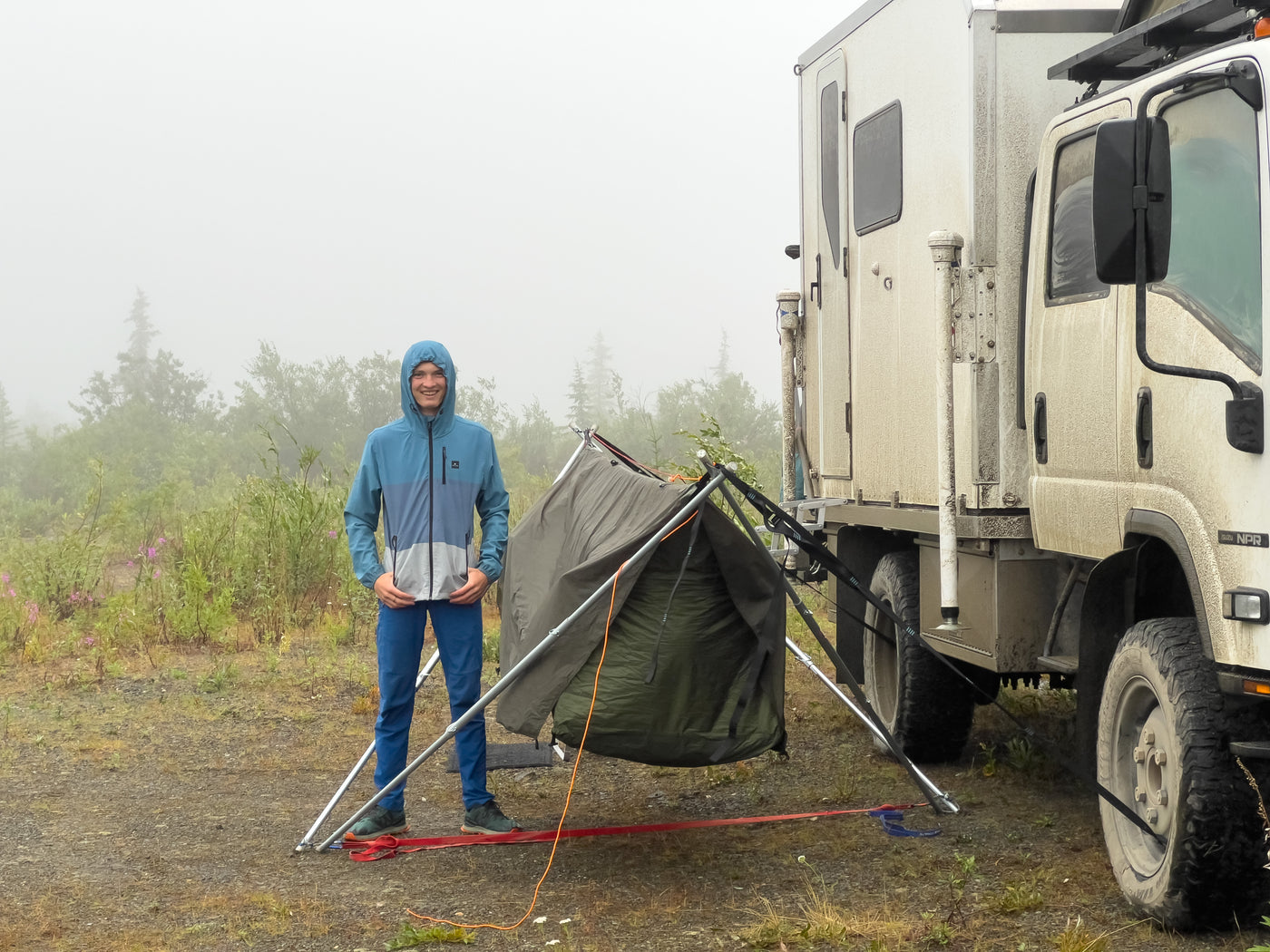 Side profile of the Isuzu NPR expedition rig in fog — photo 8