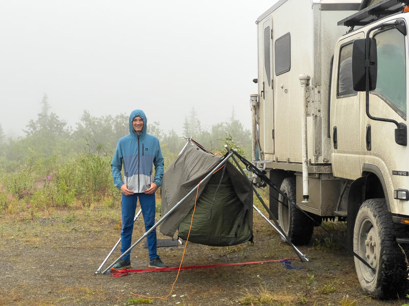 Side profile of the Isuzu NPR expedition rig in fog — photo 8