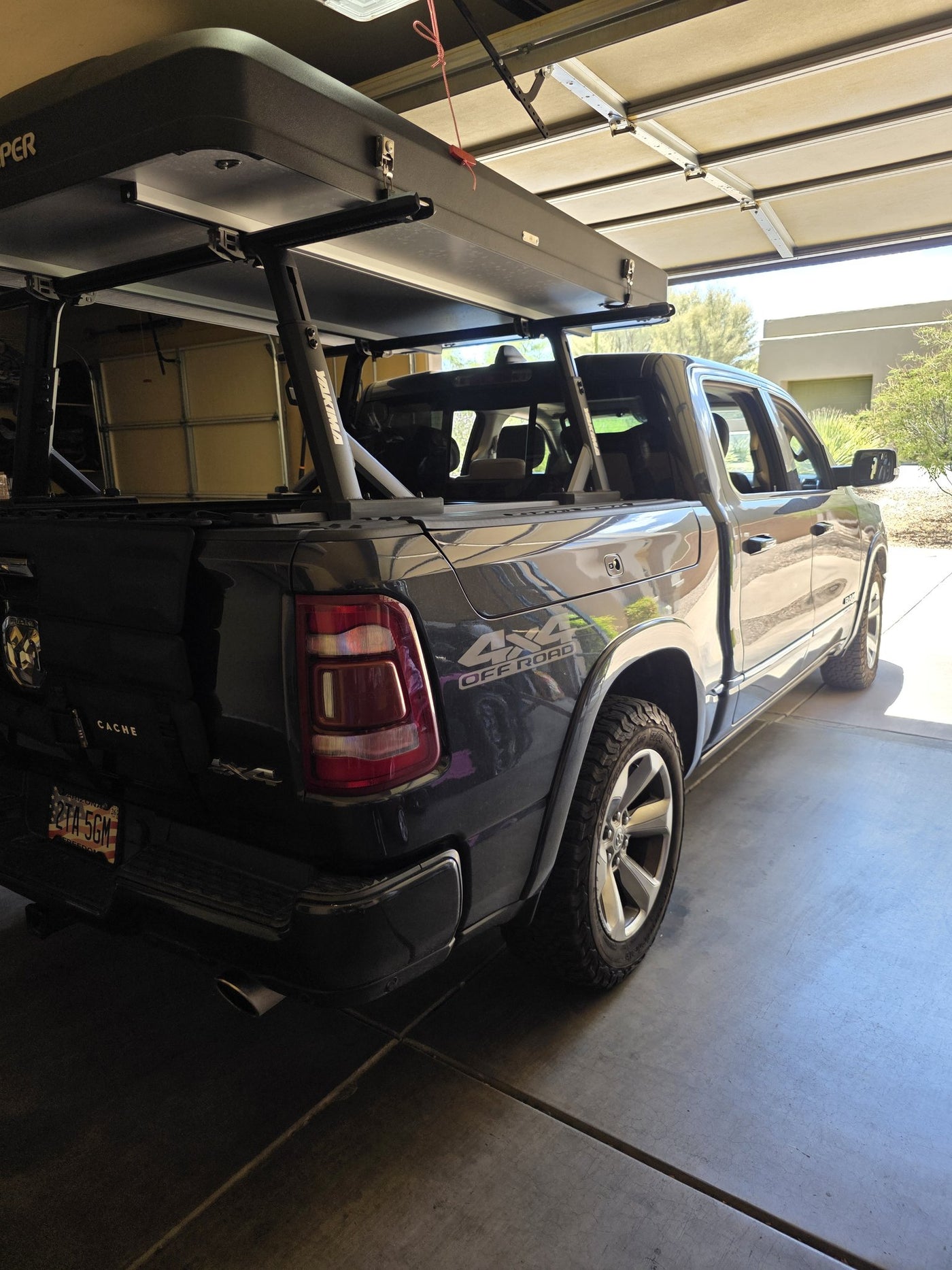 iKamper DLX hardshell closed on the truck bed rack, showing the low-profile mounted footprint — photo 4