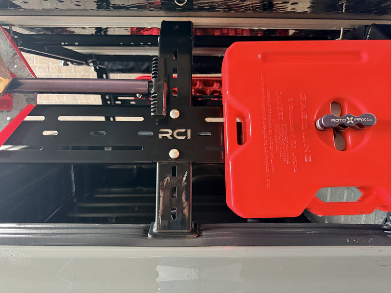 Close detail of the slotted load bar and the C-clamp upright with its adjustment holes — photo 4