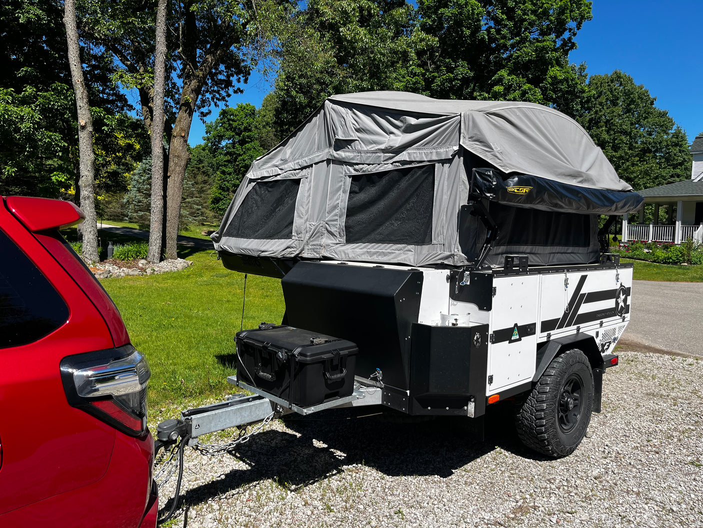 Patriot X3 trailer three-quarter view with awning and tent deployed