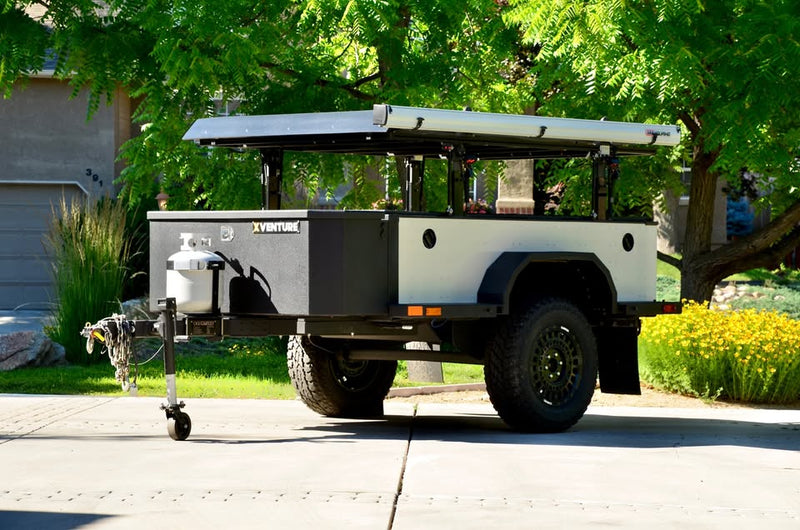 2014 Schutt Industries XVenture XV-2 overland trailer — full side profile with the elevating rack lowered for travel — photo 7