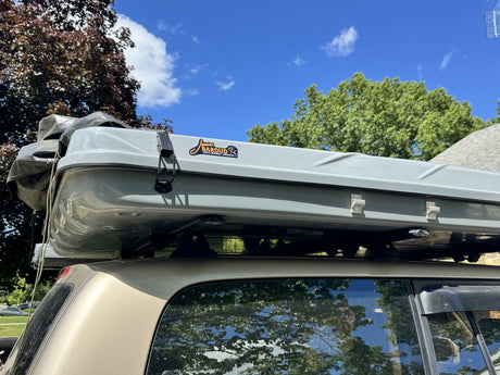 Closed hardshell of the James Baroud Discovery Xtreme XXL seen from the rear quarter, showing the clamshell seam, latches and James Baroud badge